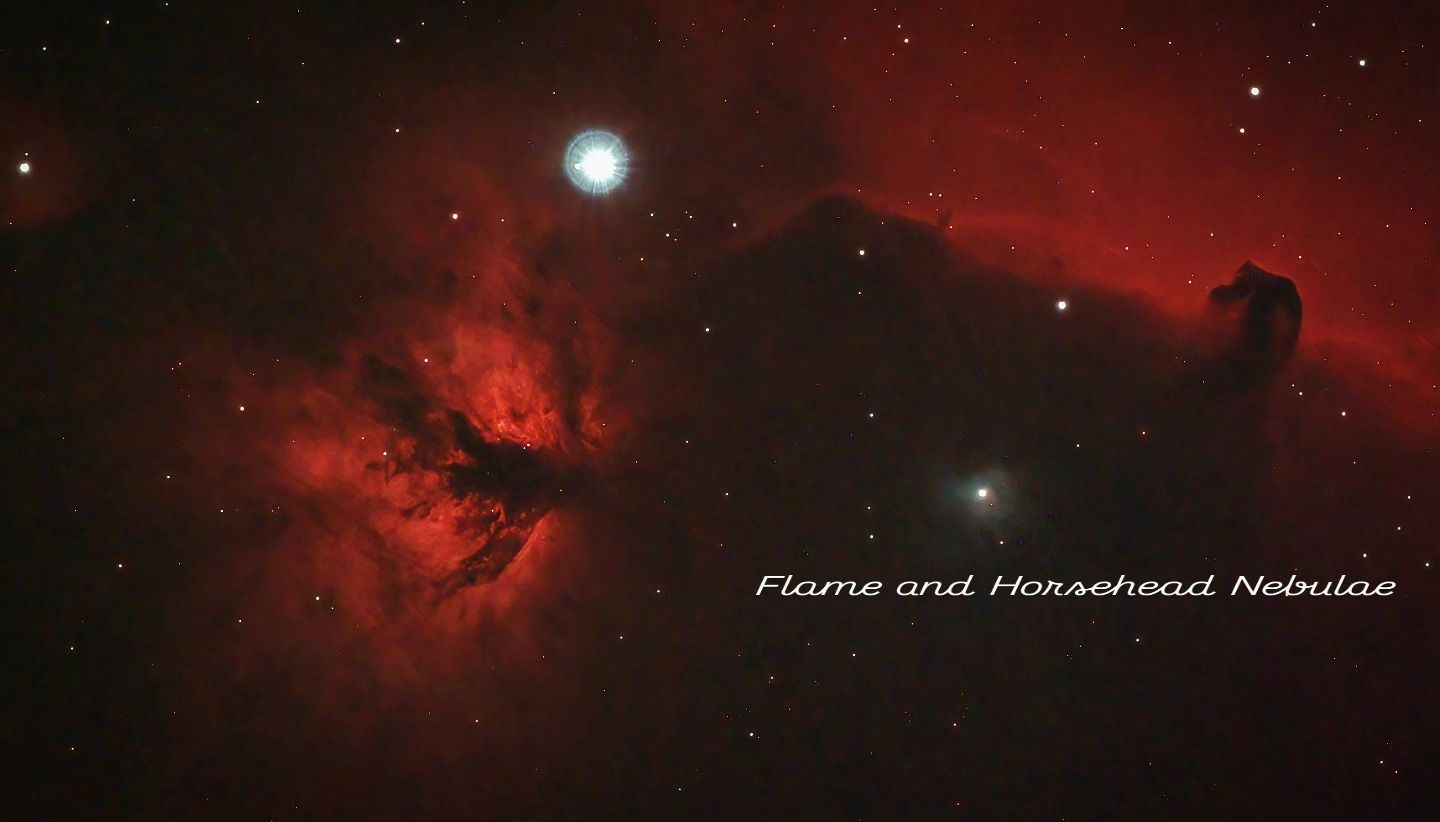 Wide red hydrogen clouds with the dark horse-head silhouette at right and the orange-red Flame Nebula beside a bright star