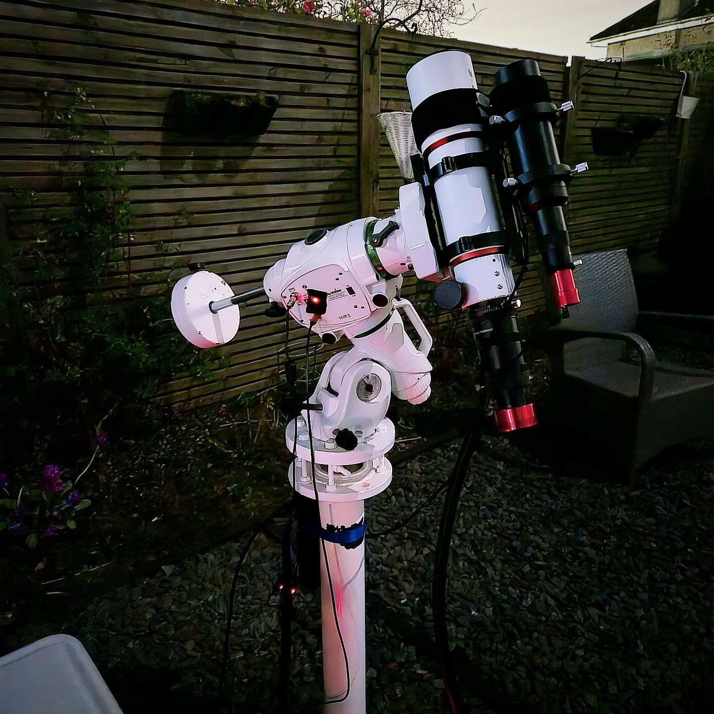 Gordon's imaging rig in a back garden: a white refractor with guidescope on a Skywatcher EQ6-R Pro mount