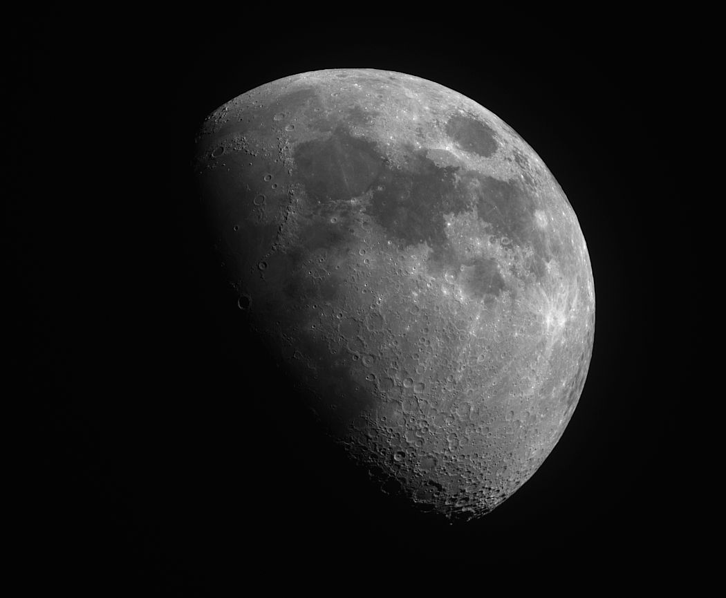Detailed grey waxing gibbous Moon showing craters and dark maria